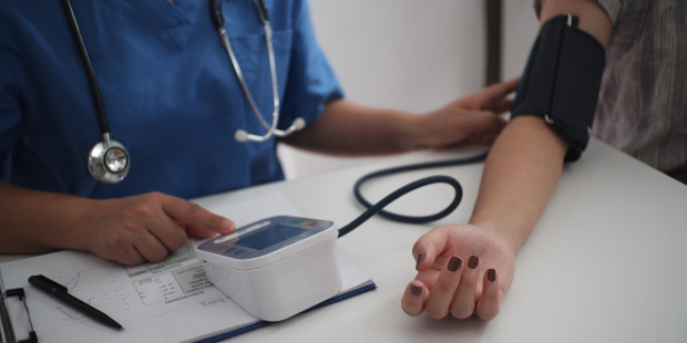 A nurse taking a blood sample.