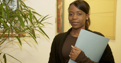 Woman holding a document file