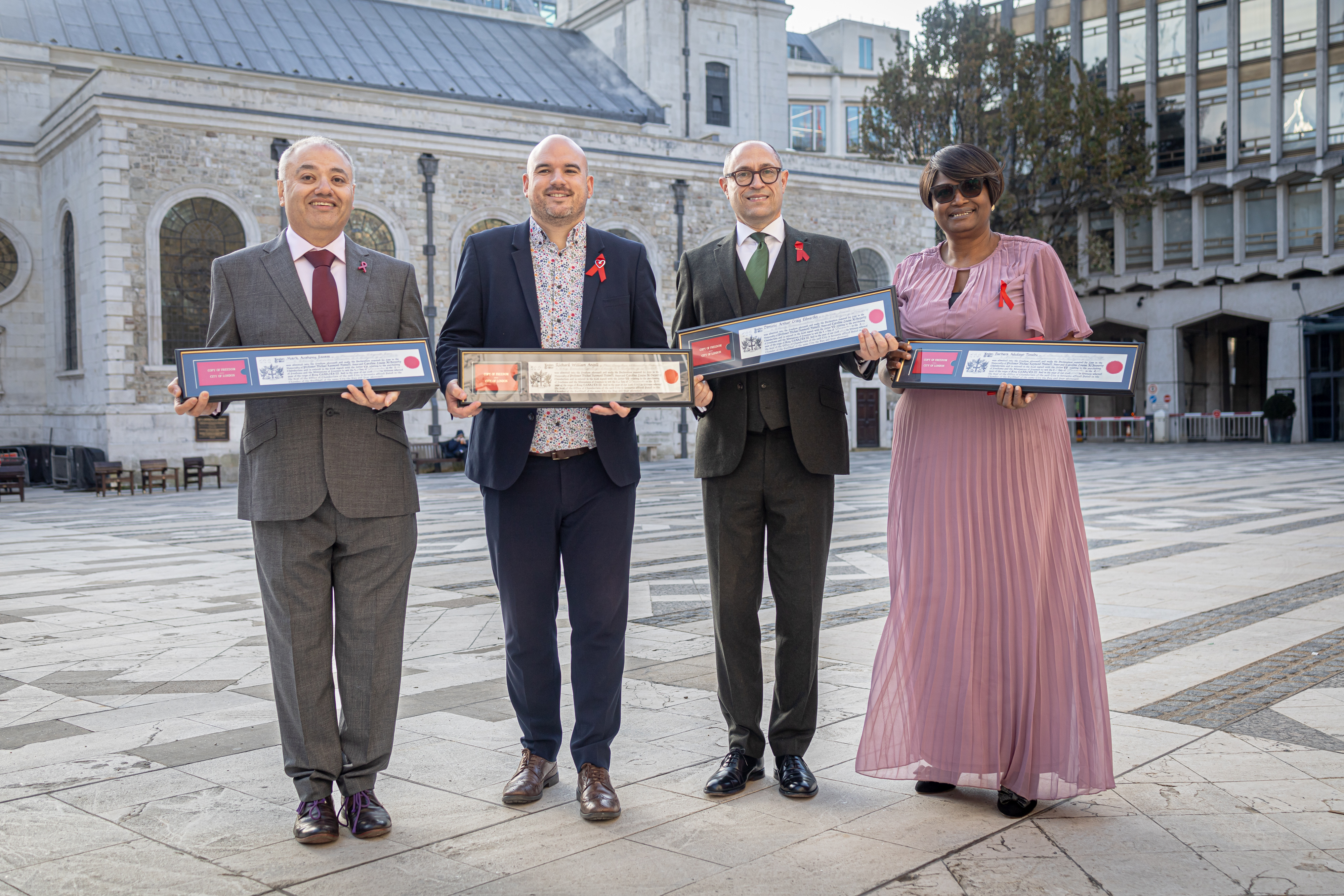 Mark Santos, Richard Angell, Dominic Edwardes and Barbara Tinubu holding City of London Freedom awards