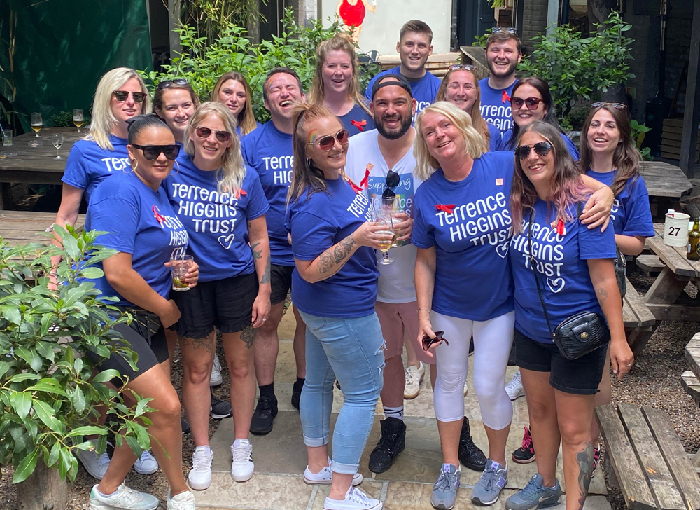 Volunteer Ambassador Frankie with a group of people wearing Terrence Higgins Trust T-shirts