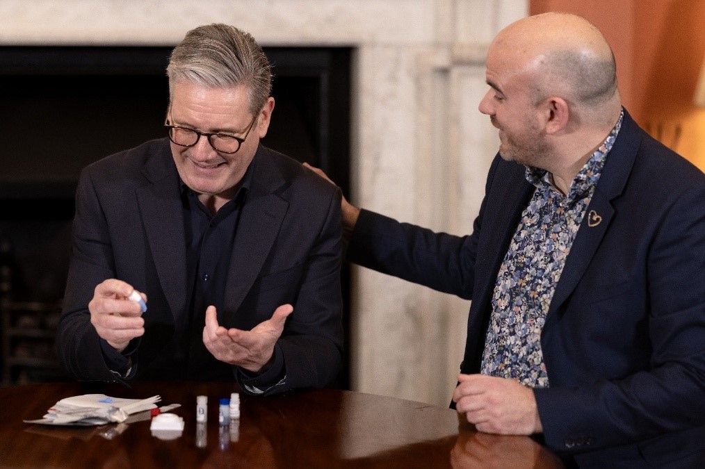 Keir Starmer sitting with Richard Angell.