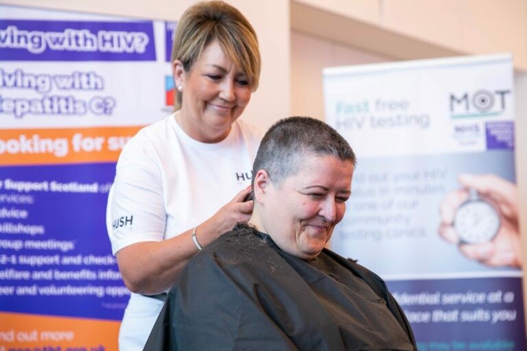 Lynne Short having her hair cut