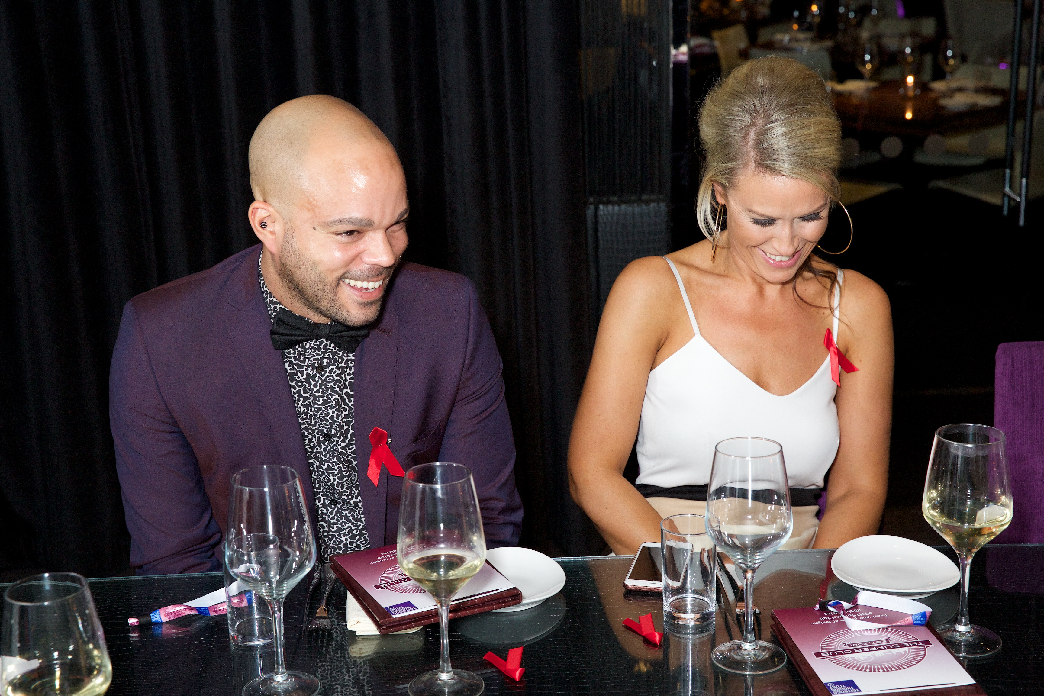 Two people sat at table for The Supper Club