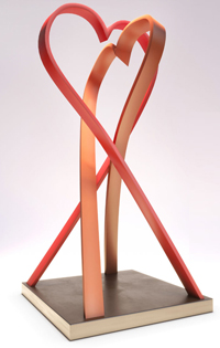 Memorial artwork consisting of two intertwined heart-shaped red ribbons 