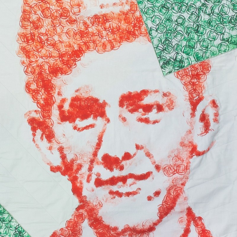 A painting of Terry as a boy in white, red and green - the colours of the Welsh flag