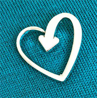 Terrence Higgins Trust Heart badge pinned to jumper