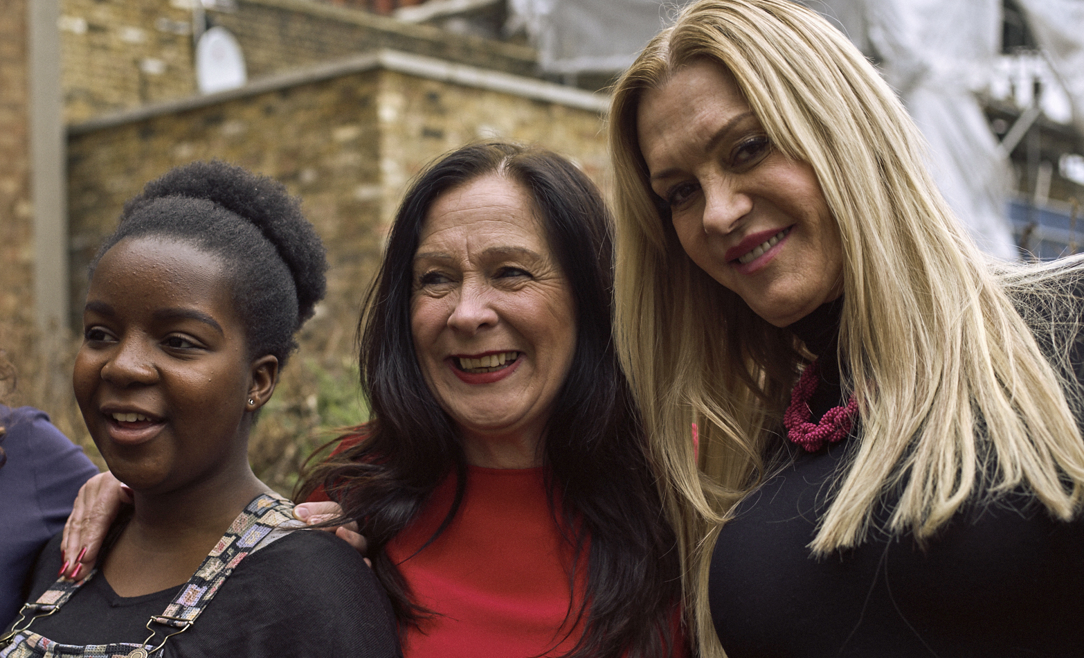 Three women smiling