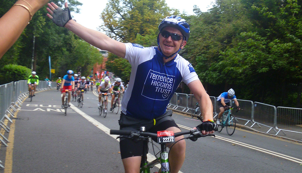 Cyclist waving in Prudential London-Surrey 100 Cyclist waving in Prudential London-Surrey 100