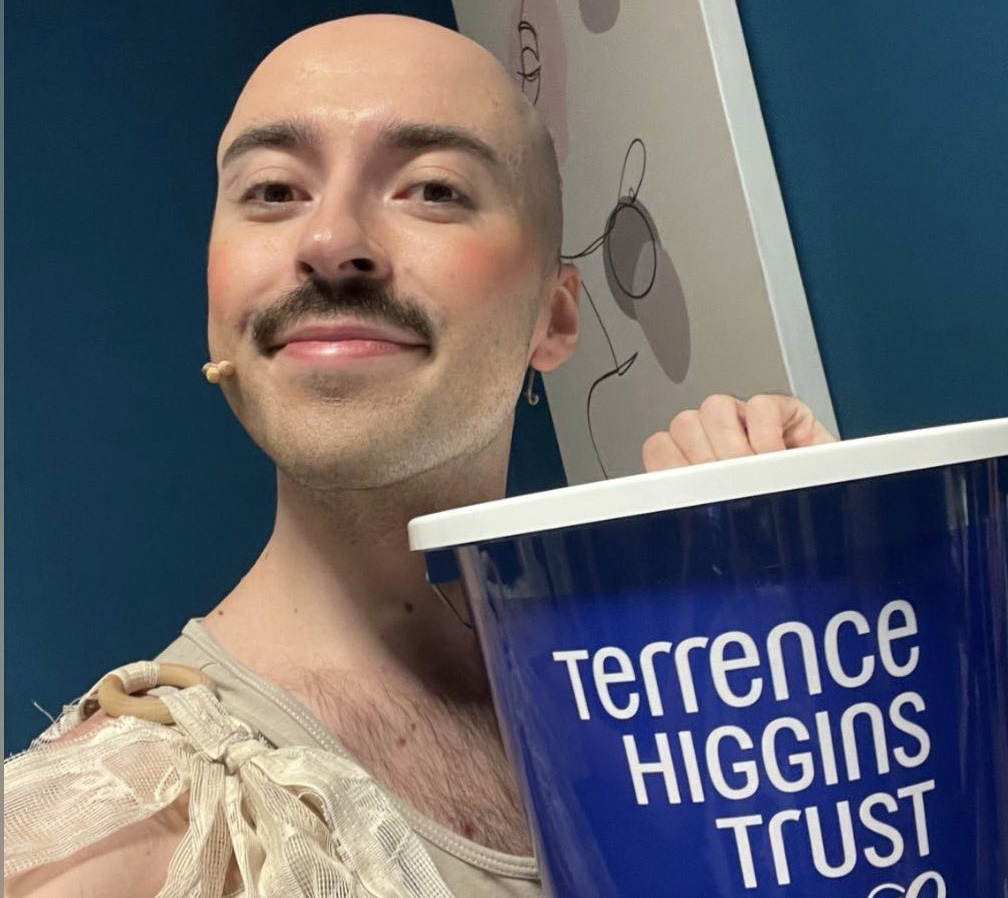 Rob Madge holding Terrence Higgins Trust collection bucket