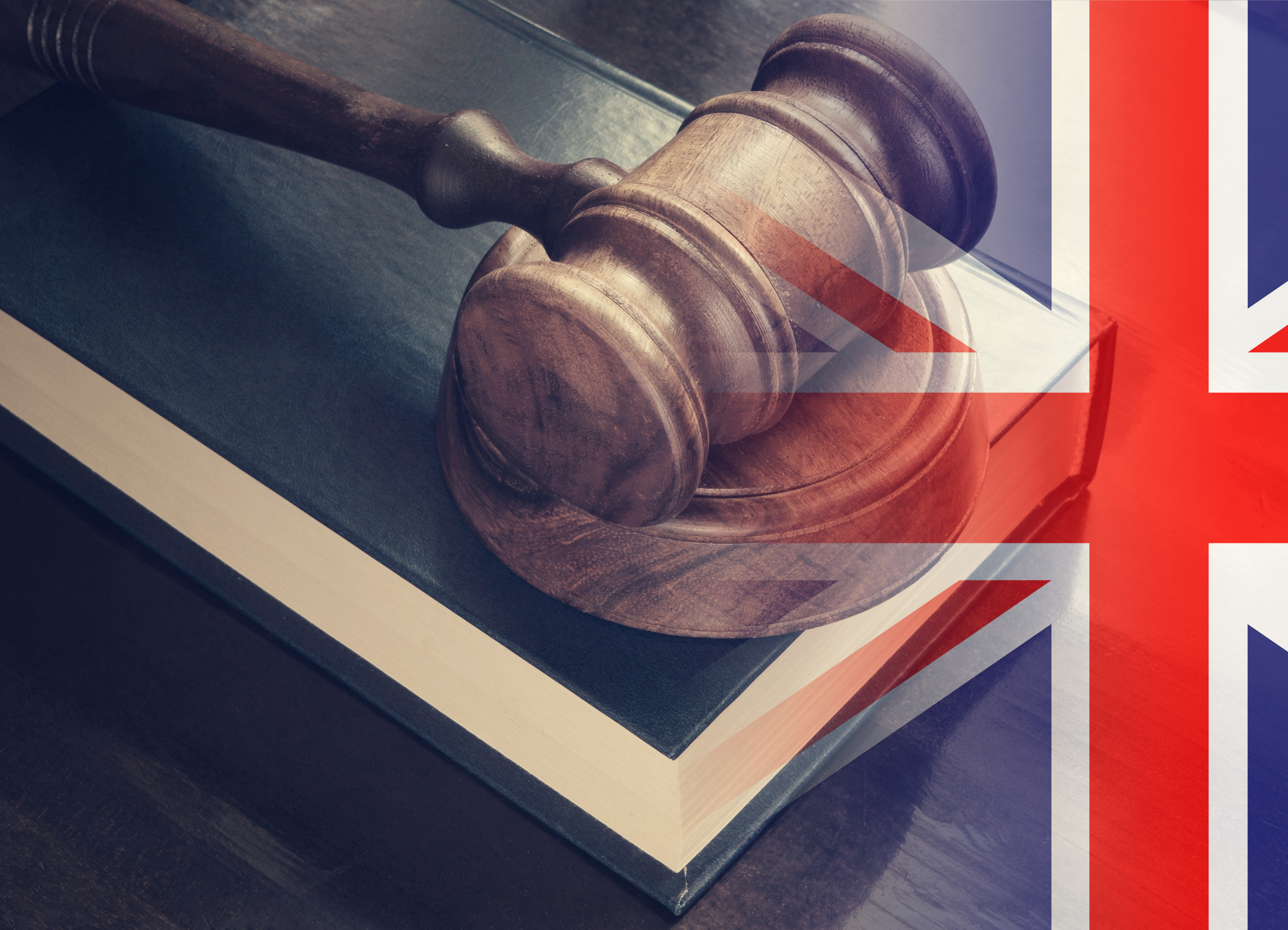 A gavel with a Union Jack overlay