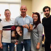Gareth Thomas holding Can't Pass It On poster with THT staff