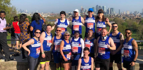 London Marathon THT group posing with London skyline London Marathon THT group posing with London skyline