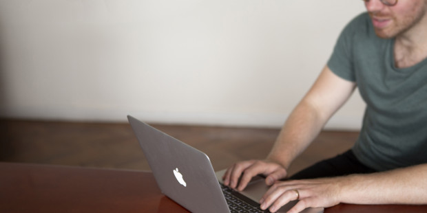 Man using open laptop