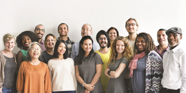 Positive Voices - studio pic of large group of smiling people