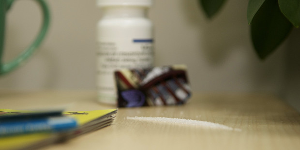 Pretend line of cocaine with HIV drugs behind
