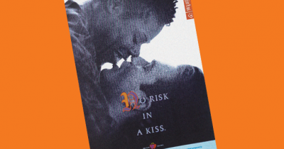 No risk with a kiss poster on an orange background