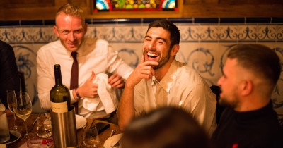 People sitting at a table and laughing