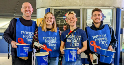 Bucket collection by four Terrence Higgins Trust people at Canary Wharf station