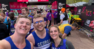 A selfie of three marathon runners representing Terrence Higgins Trust.