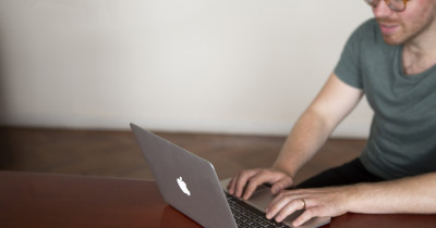 Man using open laptop