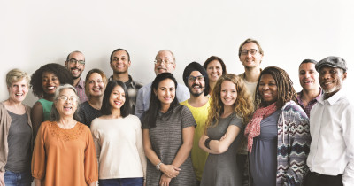 Positive Voices - studio pic of large group of smiling people