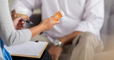 Two people talking about medication Two people talking about medication