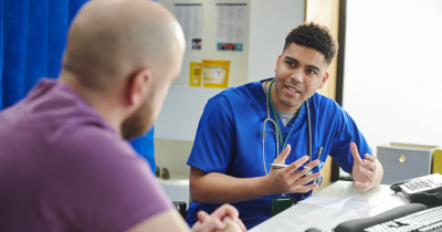 Heatlhcare professional talking to patient Heatlhcare professional talking to patient