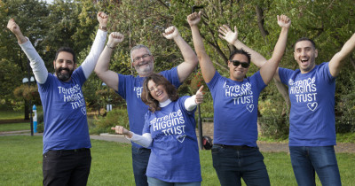 Group posing in THT shirts in a park Group posing in THT shirts in a park