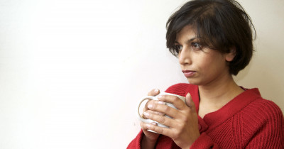 Women under the weather holding a mug
