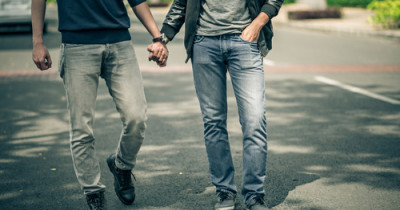 Two people holding hands