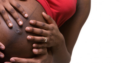 African woman belly rub