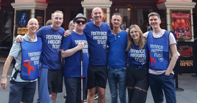 A group of Terrence Higgins Trust fundraisers outside a West End theatre.