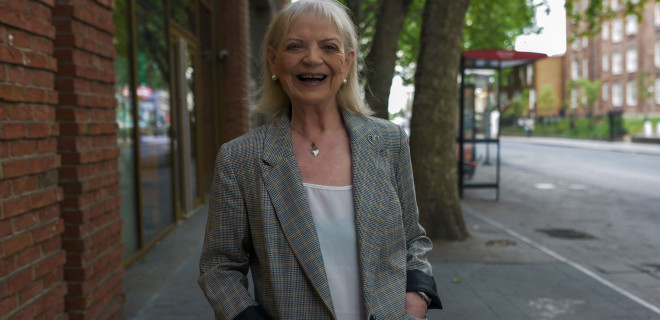 A smiling elderly woman.