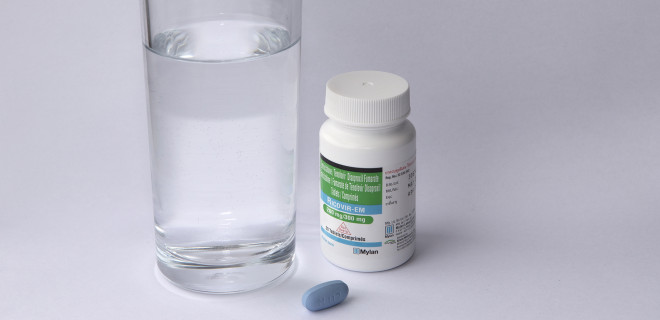 Ricovir PrEP pill and bottle with glass of water