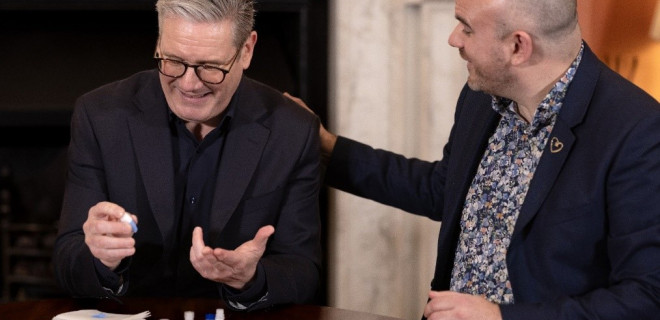 Keir Starmer sitting with Richard Angell.