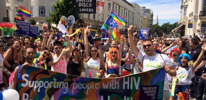 Crowd of people behind banner at Brighton Pride