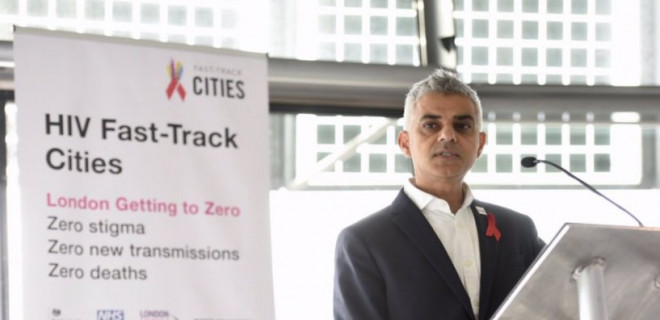 Sadiq Khan speaking in front of HIV Fast-Track Cities banner