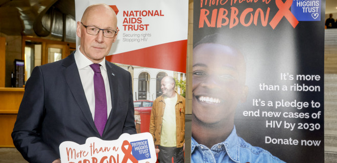 John Swinney MSP commemorating World AIDS Day in the Scottish parliament.