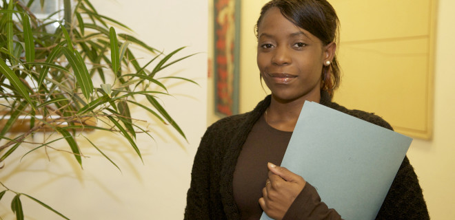 Woman holding a document file