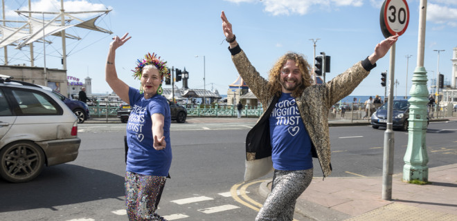 Two people walking in fancy dress and celebrating