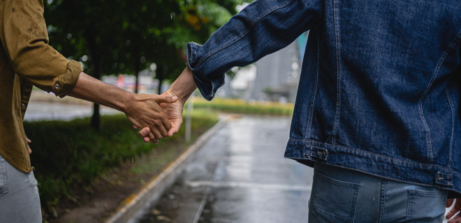 Two people holding hands