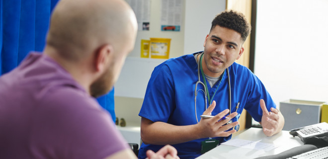 Heatlhcare professional talking to patient