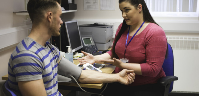 Healthcare professional with patient