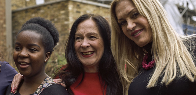 Three women smiling