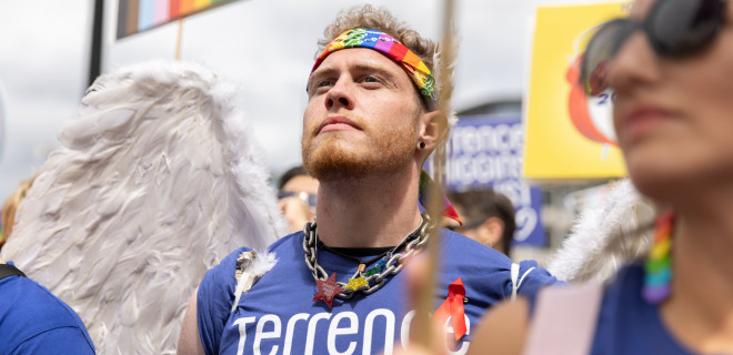 Jake Devline-Reed at Pride 2023 in blue Terrence Higgins Trust shirt