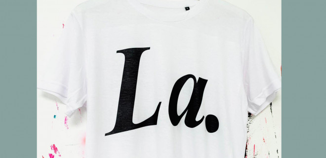 White T-shirt with 'La' black text on hanger White T-shirt with 'La' black text on hanger