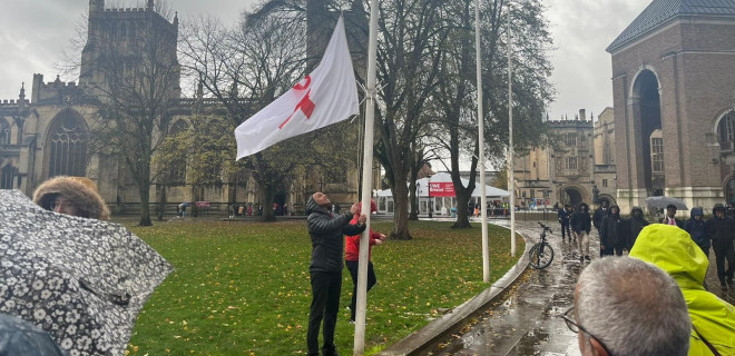 Marvin Rees putting up flag in Bristol