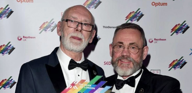 Martyn Butler OBE and Rupert Whitaker OBE holding award