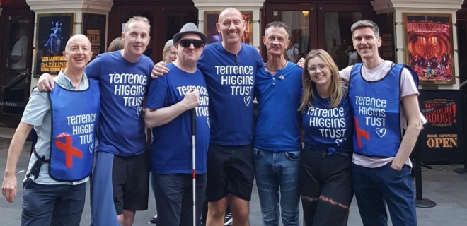 A group of Terrence Higgins Trust fundraisers outside a West End theatre.
