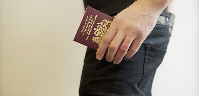 Man holding UK passport